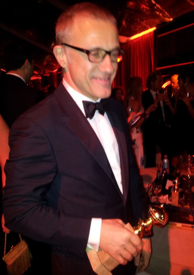 Another camera-phone snafu as Christoph Waltz thought the focusing light was the flash!