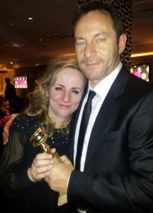 Les Miserables producer Debra Hayward celebrating the film’s big win with friend Jason Isaacs at the HBO party.